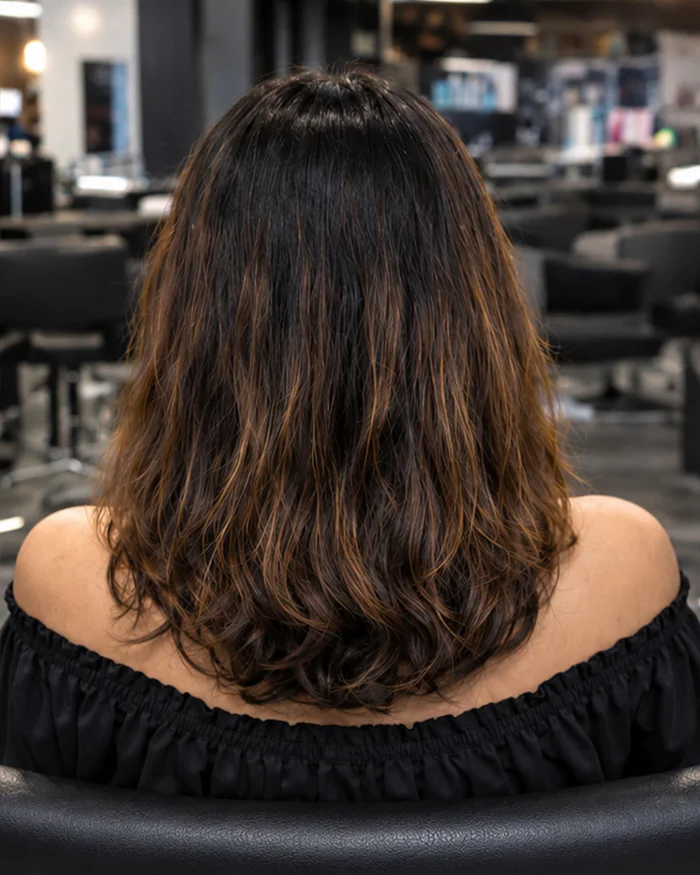Hair before a global hair colour service.