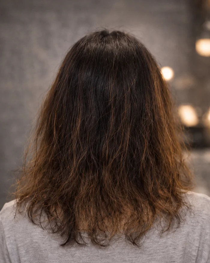 Hair before an intensive smoothing service.